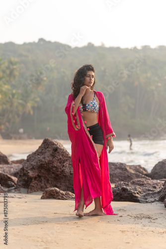 woman in red dress at the beach