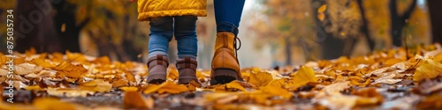 Close-Up of Mother and Little Girl Walking in Autumn Park with Dry Leaves, Highlighting Family Bond and Seasonal Beauty, Perfect for Family Day Celebrations and Parental Love Themes photo