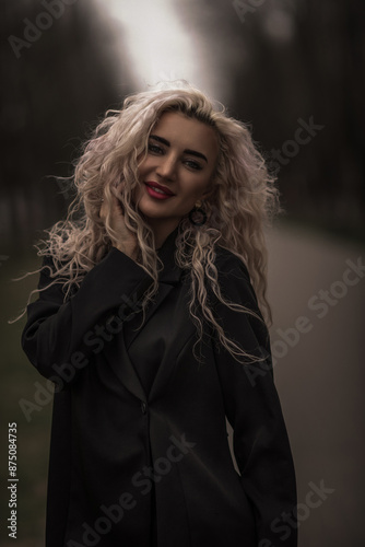 Portrait of a young beautiful blonde girl outdoors.