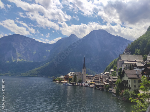 Hallstatter See, mountain lake. Village in the mountains. Austrian Alps, summer lake shore. Famous place, UNESCO heritage. Waterfront. Blue sky and clouds. Hallstatt lake, Austria. photo