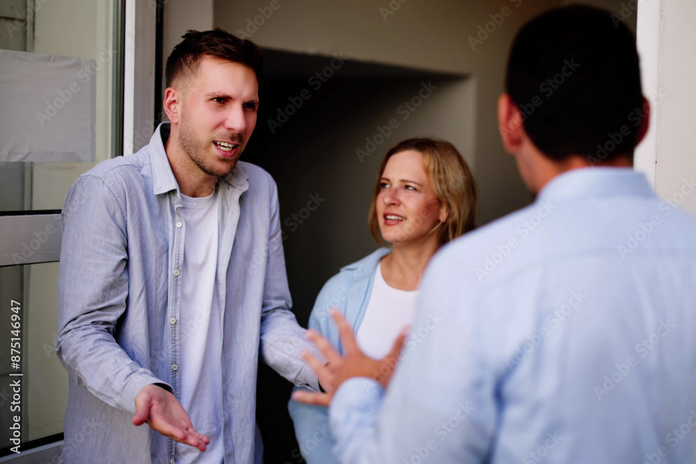 Trouble in the Next Apartment: A Worried Young Woman Watches as Neighbors Fight Trouble in the Next Apartment: A Worried Young Woman Watches as Neighbors Fight