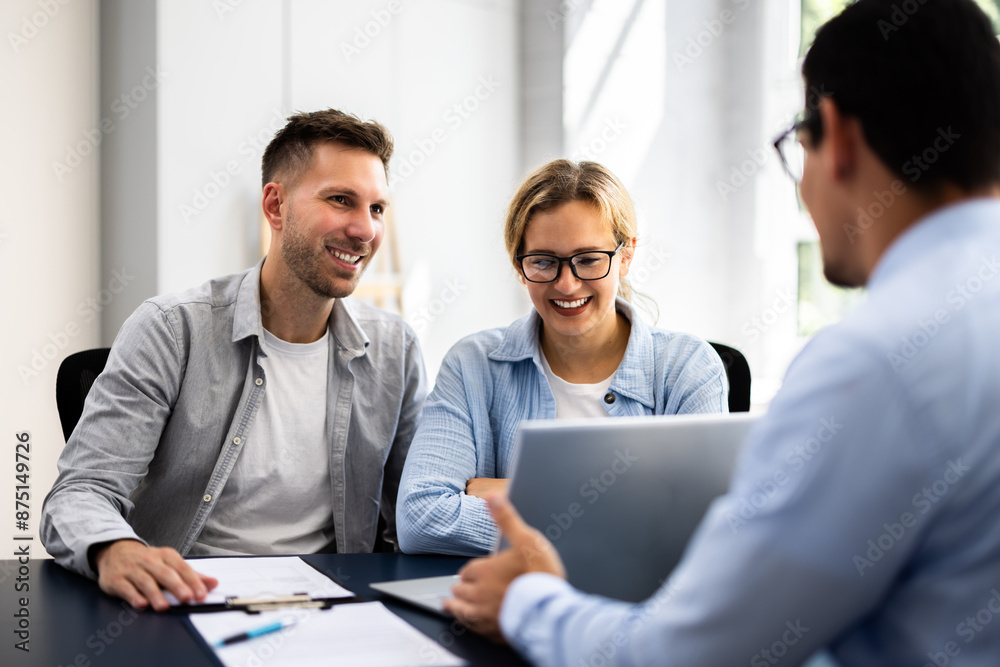 young couple is meeting with a financial planner young couple is meeting with a financial planner