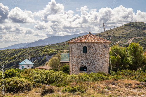 Great typical Greek windmill in the evening. In the Mediterranean architectural style of Greece. She stands on a cliff in the Mediterranean.
Potamitis Windmill, Ionian Islands, Greece photo