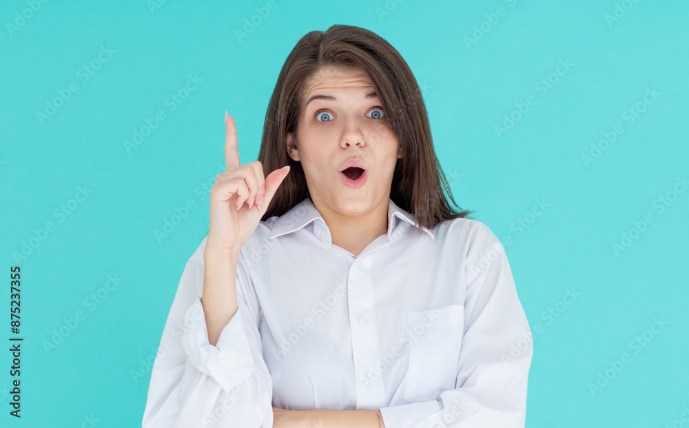 Image of excited young lady standing isolated blue background. Looking at camera have an idea. Image of excited young lady standing isolated blue background. Looking at camera have an idea.