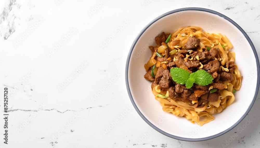 Beef Pad Thai made with organic rice noodles, a common menu item at Asian restaurants, usually contains vegetables and tofu. isolated on white background. Asian, Chinese, Thai food concept Beef Pad Thai made with organic rice noodles, a common menu item at Asian restaurants, usually contains vegetables and tofu. isolated on white background. Asian, Chinese, Thai food concept