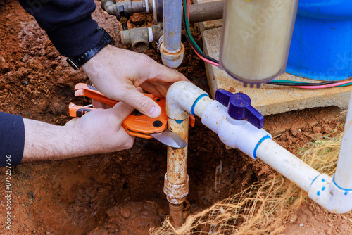Fotografie Water supply artesian well pump maintenance for private home