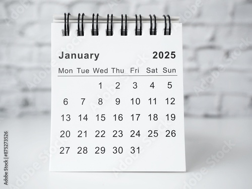 January 2025 white monthly desk calendar on a table