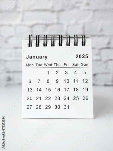 January 2025 white monthly desk calendar on a table