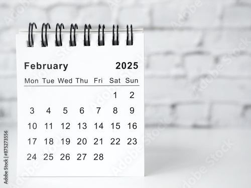 February 2025 white monthly desk calendar on a table