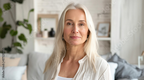 Free Download Portrait of a woman in living room interior. Blond lady with nice skin, happy and nice - GFXLoad