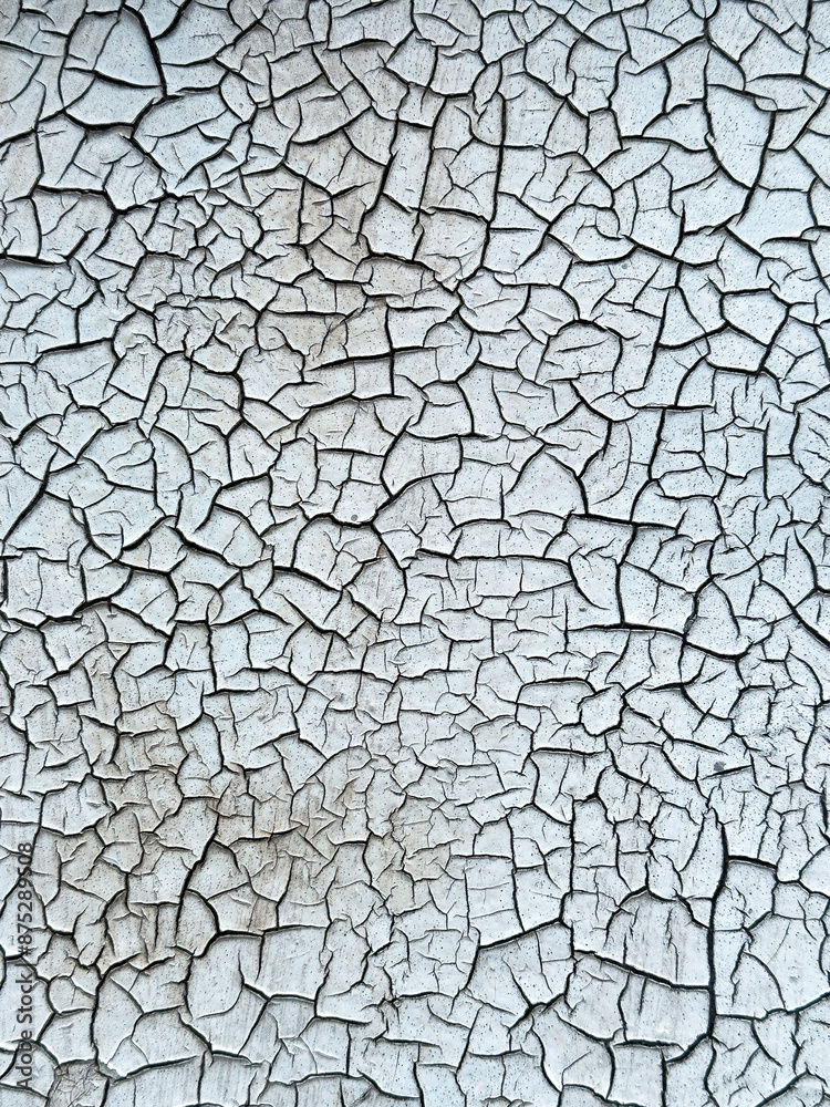Old cracked paint forming abstract pattern backgrond or textured surface Old cracked paint forming abstract pattern backgrond or textured surface