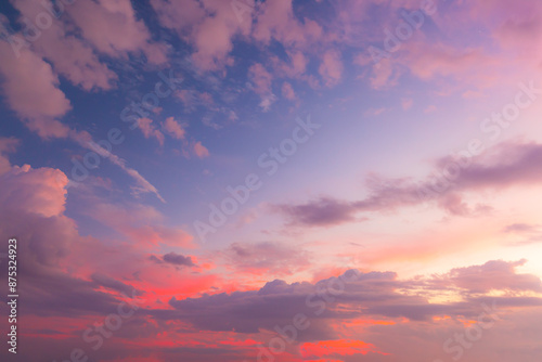 Clouds and orange sky,Real majestic sunrise sunset sky background with gentle colorful clouds without birds.Panorama, large 