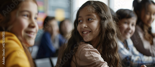 A group of cheerful children engaging in a lively conversation in a classroom, filled with warm light and vibrant energy.
