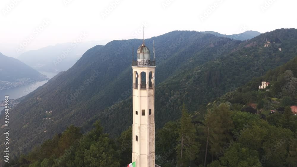 Aerial Reveal Pull Back Drone Footage of the Faro Voltiano Volta Lighthouse in Brunate, Como lake, Como province, Lombardy, Italy