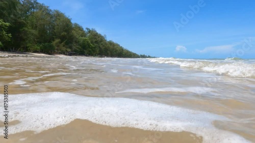 Beautiful landscape, a wave runs on the sandy. Huge waves crashing and splashing 