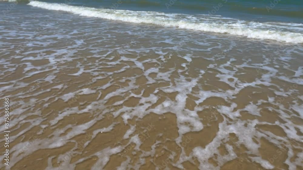 Beautiful landscape, a wave runs on the sandy. Huge waves crashing and splashing Beautiful landscape, a wave runs on the sandy. Huge waves crashing and splashing