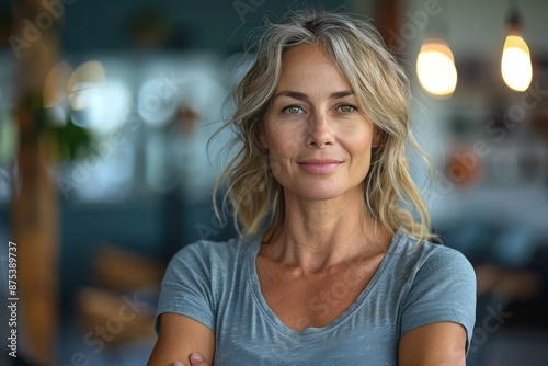 Fit and Fabulous: Mature Woman Standing Strong in Fitness Studio