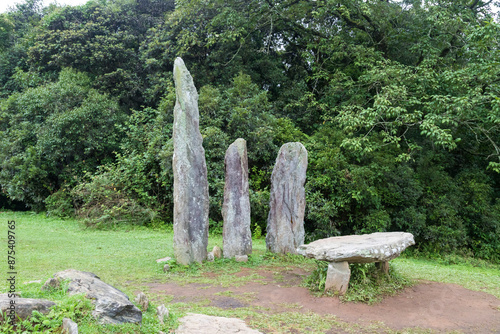 Mawphlang Sacred forest is an ancient forest preserved by the local khasi people near shillong meghalaya or lawkyntang Standing sacred stone monoliths in meghalaya India. photo