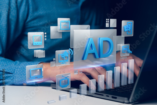 A person working on a laptop with floating digital marketing icons such as ads, computers, and graphs. This image illustrates the concept of digital marketing strategies, highlighting online advertisi photo