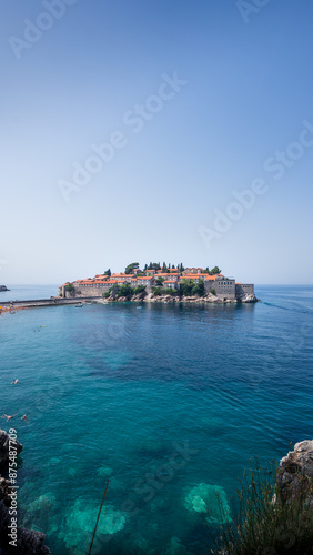 Blick auf die Insel Sveti Stefan, eine ehemalige Fischerinsel nun Luxushotel in Montenegro (Hochformat) photo