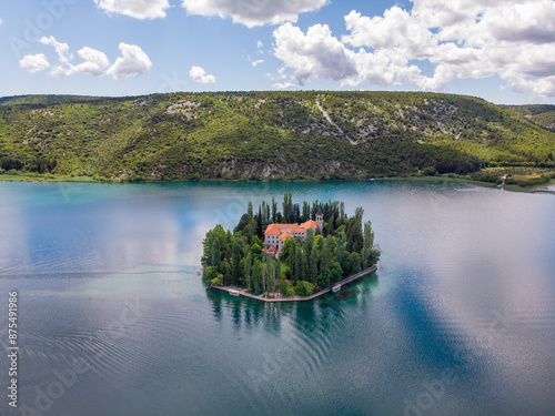 Die Insel Visovac (kroatisch: Visovački muzej) im Krka Nationalpark mit dem Franziskaner Kloster in Kroatien als Luftaufnahme photo