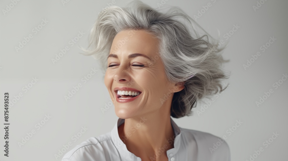 Beautiful gorgeous 50s mid age beautiful elderly senior model woman with grey hair laughing and smiling. Mature old lady close up portrait. Healthy face skin care beauty, skincare cosmetics, dental. Beautiful gorgeous 50s mid age beautiful elderly senior model woman with grey hair laughing and smiling. Mature old lady close up portrait. Healthy face skin care beauty, skincare cosmetics, dental.