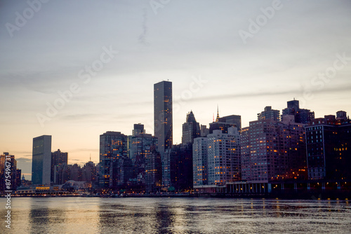 Manhattan, New York City, New York, USA - The skyscrapers of the East Side of Manhattan towering over the East River including United Nations Building and the FDR Drive and 1 Dag Hammarskjold Plaza