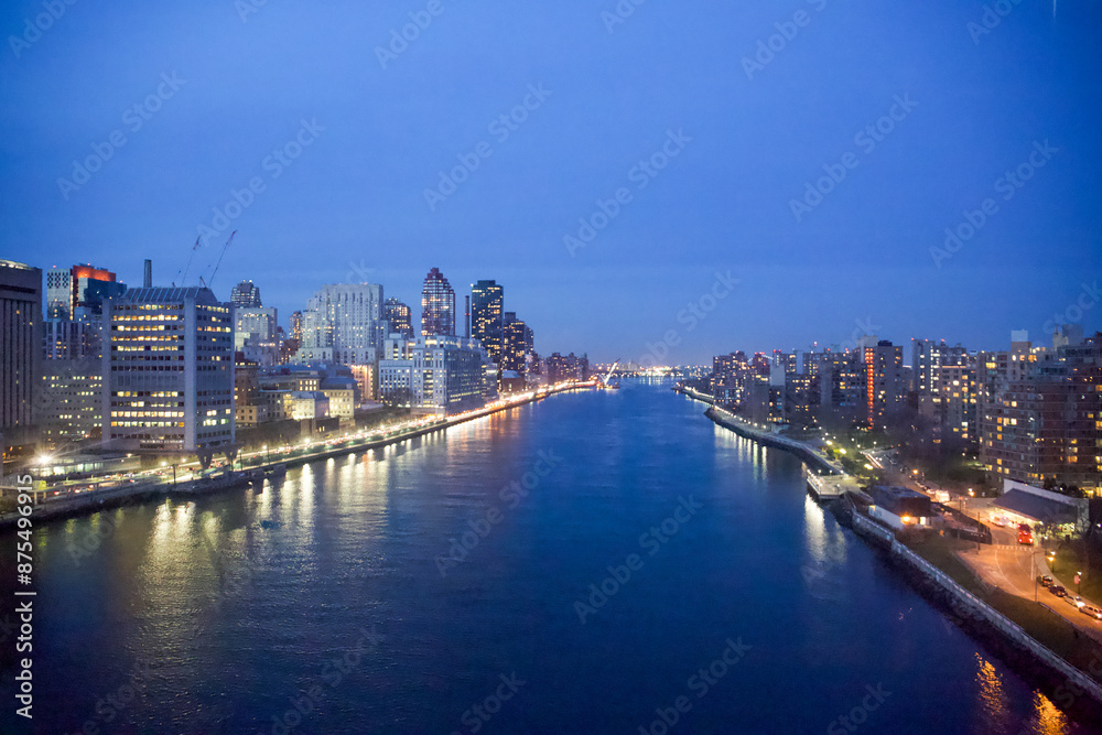 New York City, New York, USA - Drone view of the East River, Roosevelt Island, the FDR drive with the Triboro Bridge in the distance New York City, New York, USA - Drone view of the East River, Roosevelt Island, the FDR drive with the Triboro Bridge in the distance