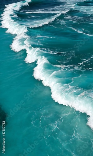 Vibrant turquoise ocean waves with white foam, capturing the sea's dynamic motion.