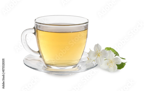 Aromatic jasmine tea in glass cup and flowers isolated on white