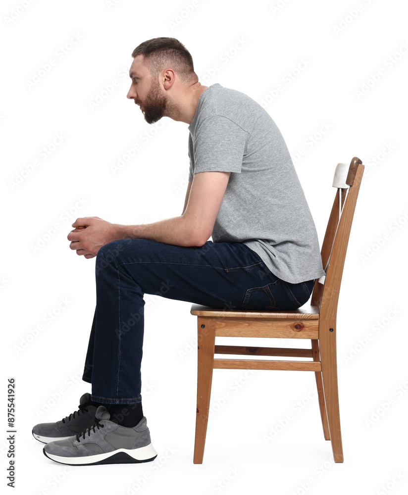 Man with poor posture sitting on chair against white background Man with poor posture sitting on chair against white background