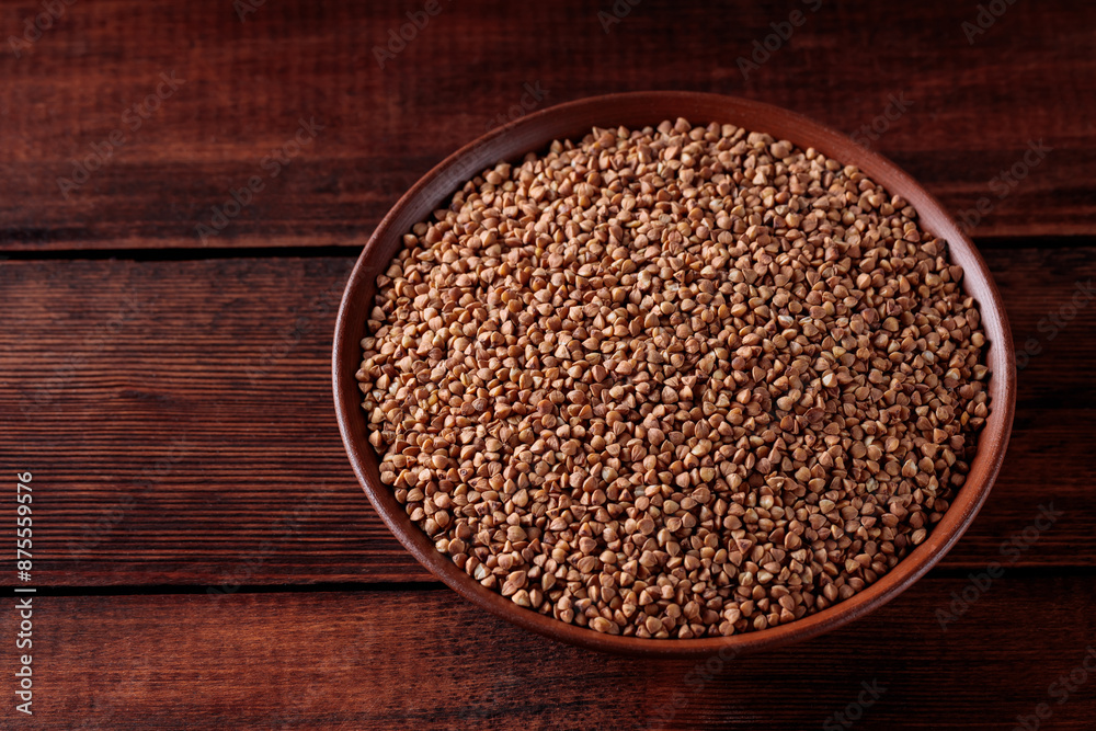Uncooked Buckwheat Grains on Wooden Boards, Copy Space