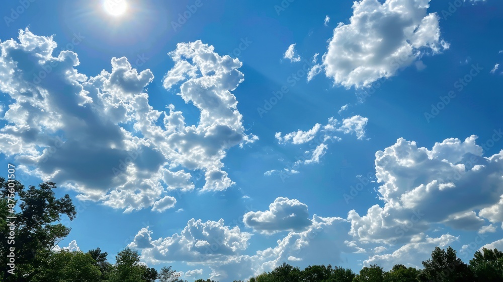 A bright blue sky with puffy white clouds. It's a perfect summer day A bright blue sky with puffy white clouds. It's a perfect summer day