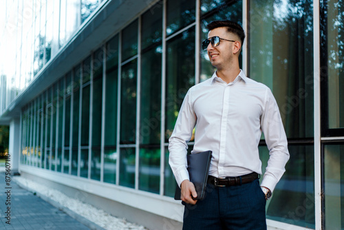 Man in Dress Shirt and Tie Standing in Front of Building