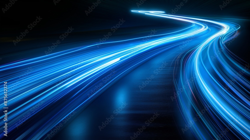 Bright blue light trails curve dynamically against a dark Bright blue light trails curve dynamically against a dark