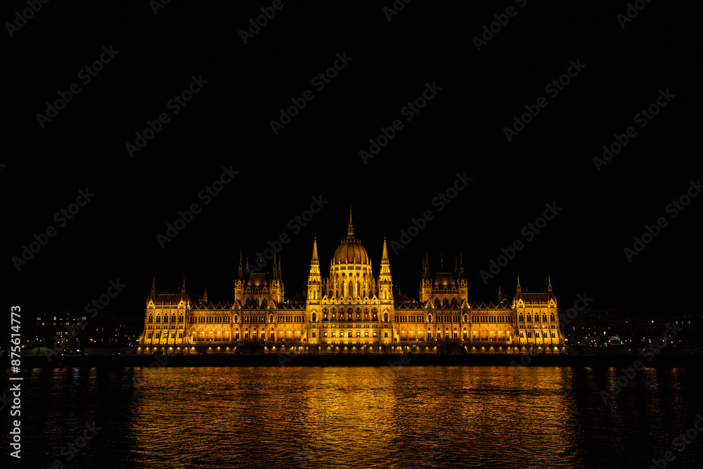 Obraz premium Night view of the Budapest parliament. Parliament lights from the Buda coast