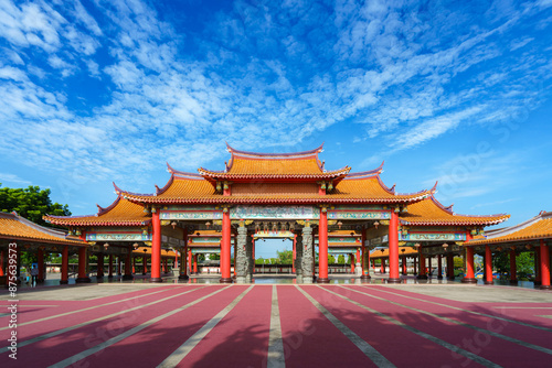 pier stretching into the sea at sunset with a serene sky and clouds above the ocean