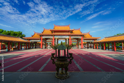 pier stretching into the sea at sunset with a serene sky and clouds above the ocean
