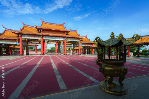 pier stretching into the sea at sunset with a serene sky and clouds above the ocean