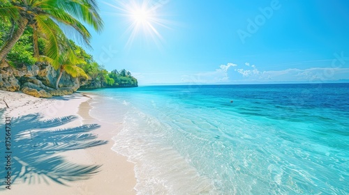 Stunning beach landscape with crystal-clear blue sea, white sand, and palm trees in bright sunlight.