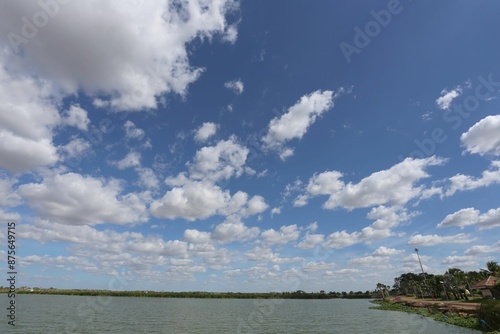 The scenery around Bueng Thung Sang has water hyacinths growing along the shore.