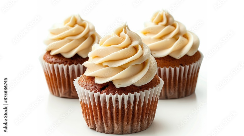 Vanilla cupcake with rich cream icing isolated on a white background