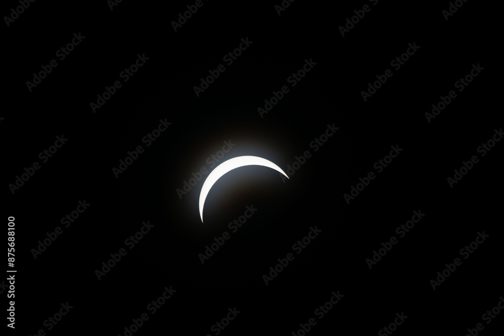 Total eclipse waxing as moon begins to cover the sun Total eclipse waxing as moon begins to cover the sun