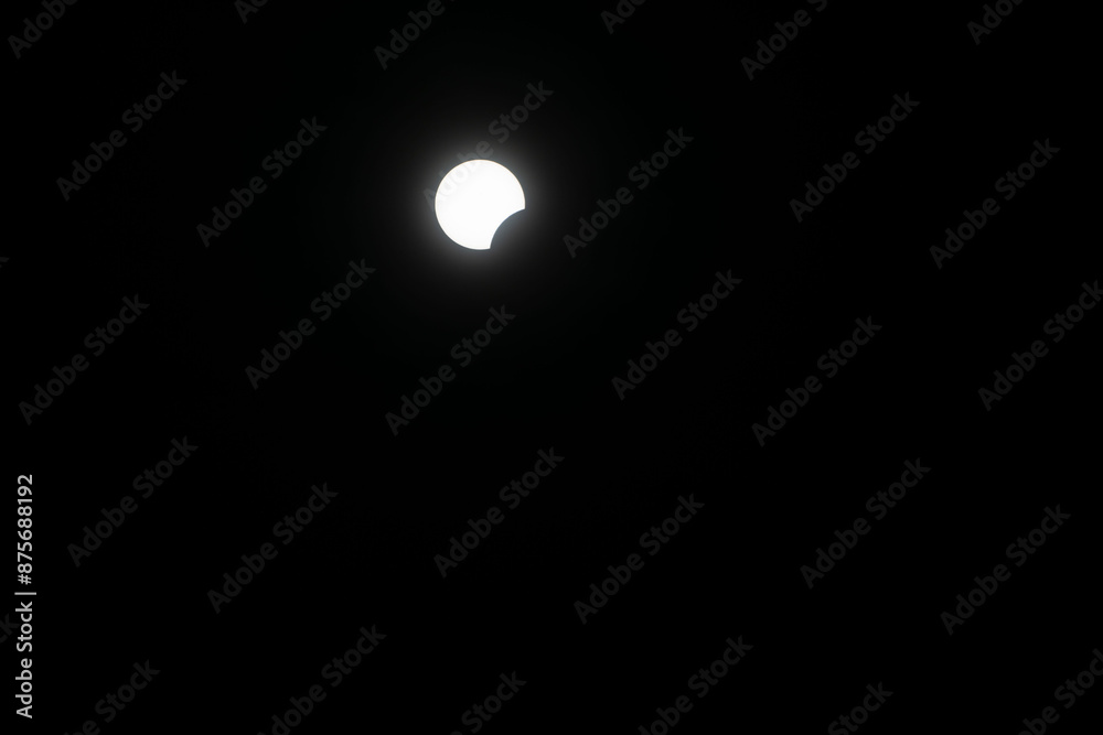 Total eclipse waxing as moon begins to cover the sun Total eclipse waxing as moon begins to cover the sun