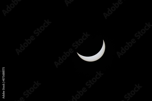 Total eclipse waning as moon begins to uncover the sun