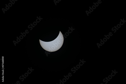 Total eclipse waning as moon begins to uncover the sun