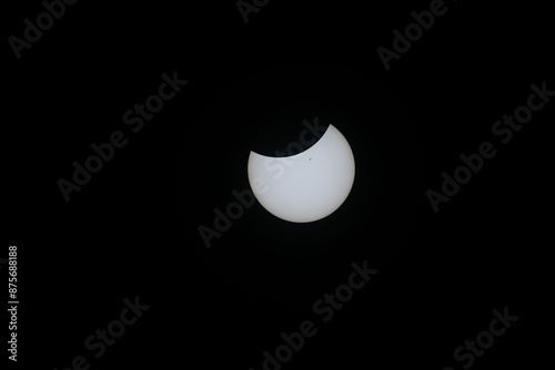 Total eclipse waning as moon begins to uncover the sun