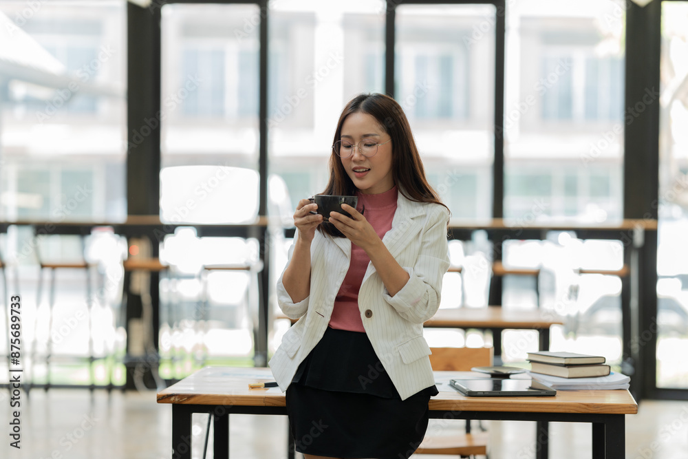 Businesswomen Working and talking about work documents at the office. Businesswomen Working and talking about work documents at the office.