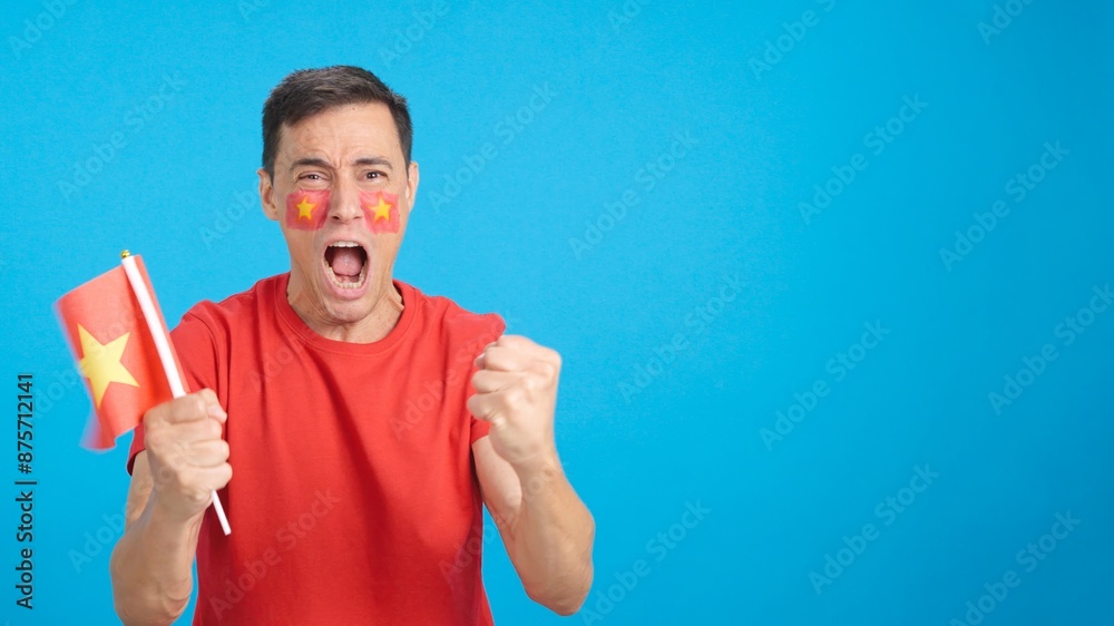Man cheering for Vietnam screaming and waving a national flag Man cheering for Vietnam screaming and waving a national flag