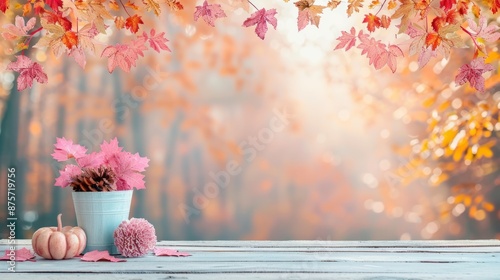 A rustic wooden table with pink fall decor set against a backdrop of colorful autumn leaves.